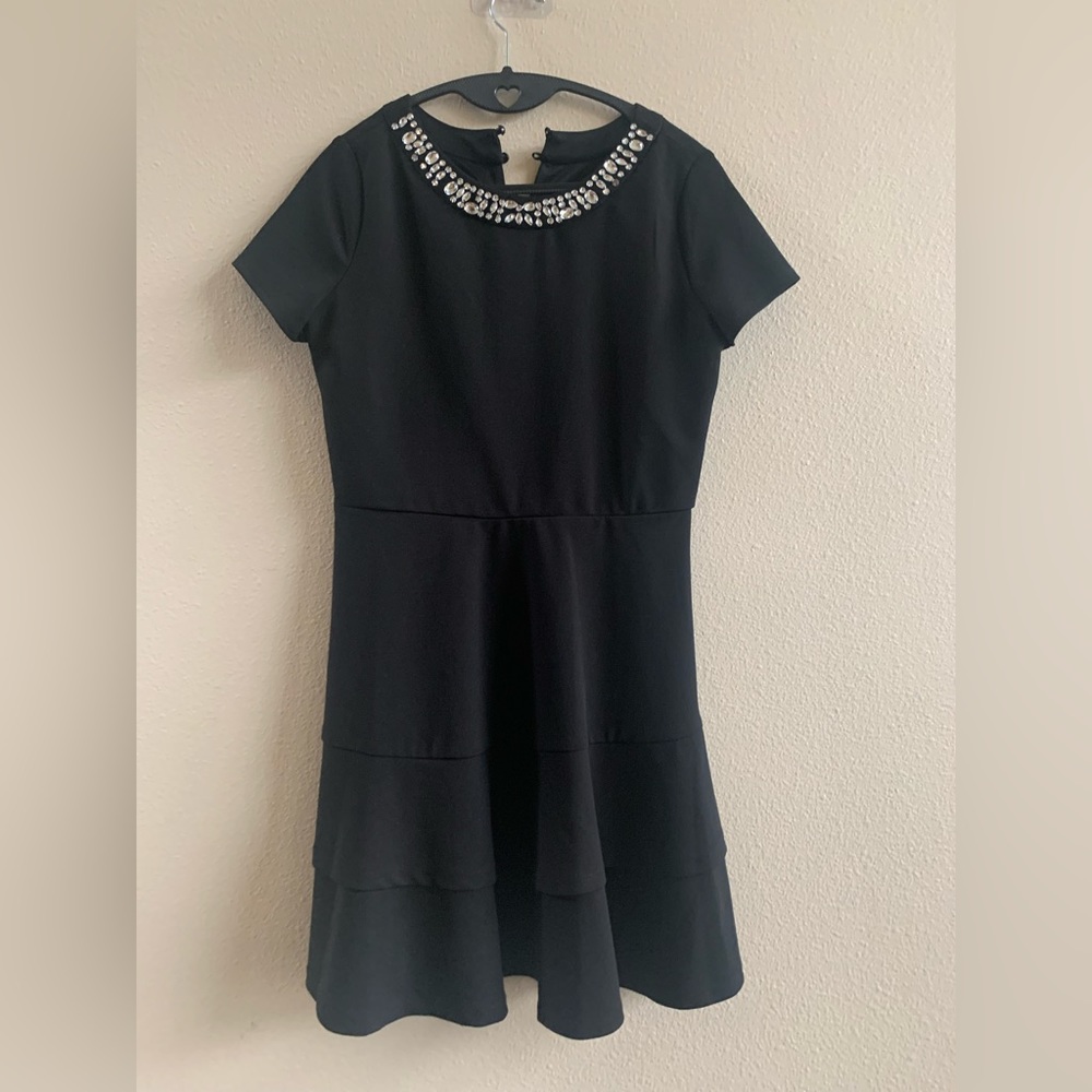 In Girl black dress with rhinestone detail. Girls Size 16.